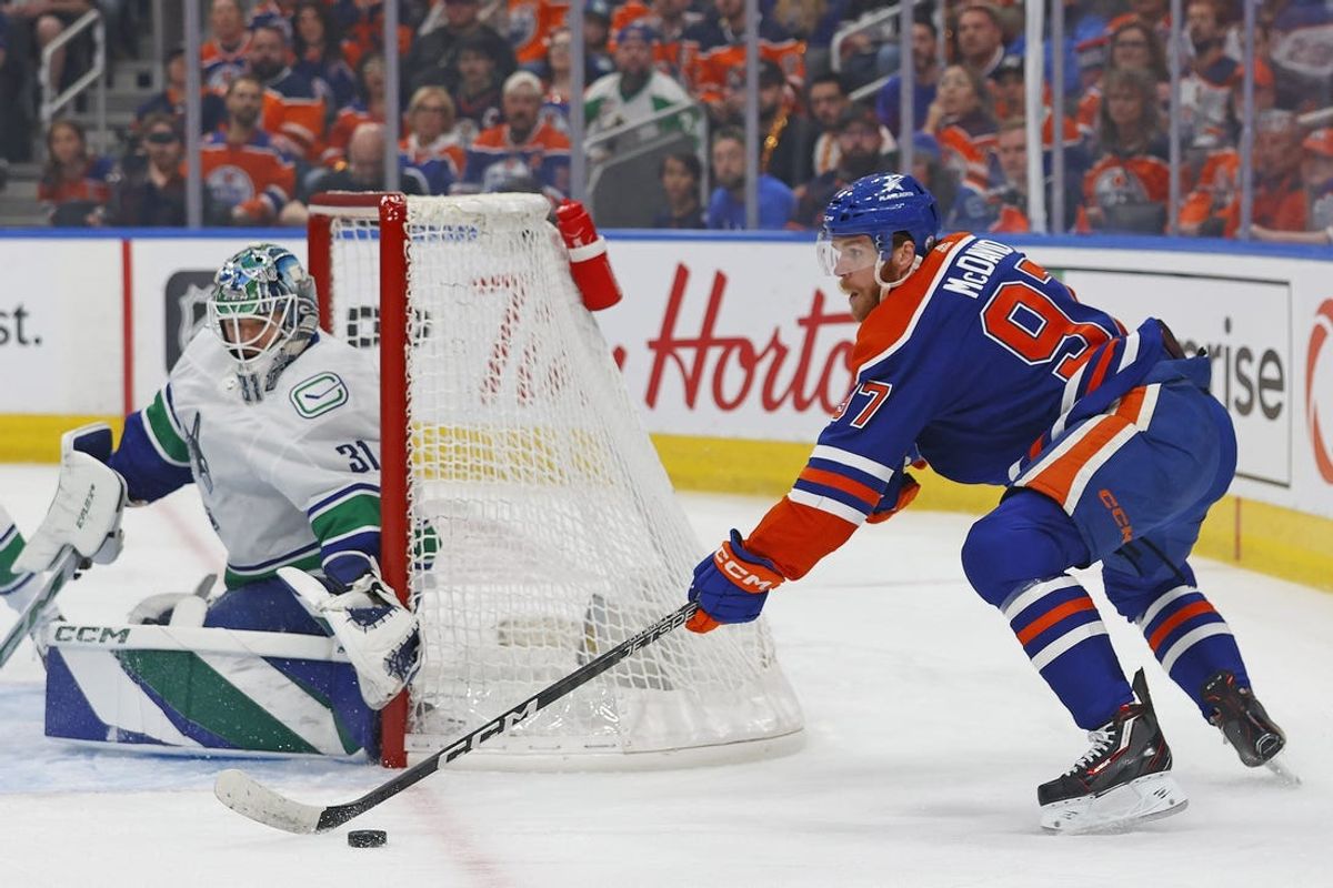 May 14, 2024; Edmonton, Alberta, CAN; Edmonton Oilers forward Connor McDavid (97) looks to make a pass in front of Vancouver Canucks goaltender Arturs Silovs (31) during the first period in game four of the second round of the 2024 Stanley Cup Playoffs at Rogers Place. Mandatory Credit: Perry Nelson-USA TODAY Sports
