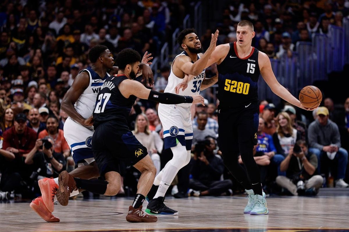 May 14, 2024; Denver, Colorado, USA; Denver Nuggets center Nikola Jokic (15) controls the ball under pressure from Minnesota Timberwolves center Karl-Anthony Towns (32) as guard Jamal Murray (27) and guard Anthony Edwards (5) battle for position in the first quarter during game five of the second round for the 2024 NBA playoffs at Ball Arena. Mandatory Credit: Isaiah J. Downing-USA TODAY Sports