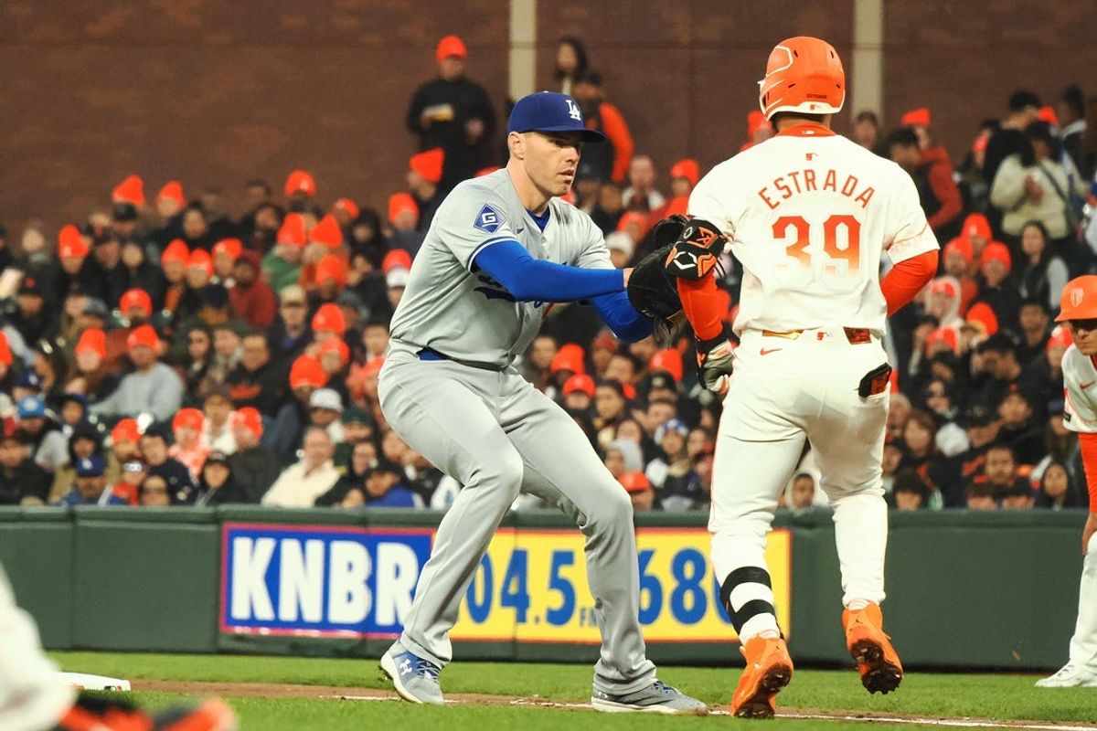 May 14, 2024; San Francisco, California, USA; Los Angeles Dodgers first baseman Freddie Freeman (5) tags out San Francisco Giants second baseman Thairo Estrada (39) during the fifth inning at Oracle Park. Mandatory Credit: Kelley L Cox-USA TODAY Sports