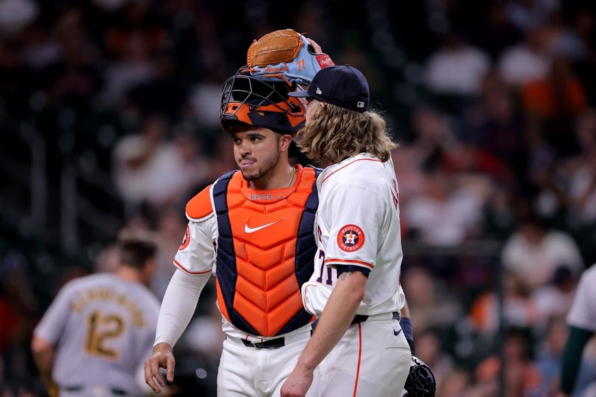 May 14, 2024; Houston, Texas, USA; Houston Astros relief pitcher Josh Hader (71) and Houston Astros catcher Yainer Diaz (21) reacts after retiring the side against the Oakland Athletics during the tenth inning at Minute Maid Park. Mandatory Credit: Erik Williams-USA TODAY Sports