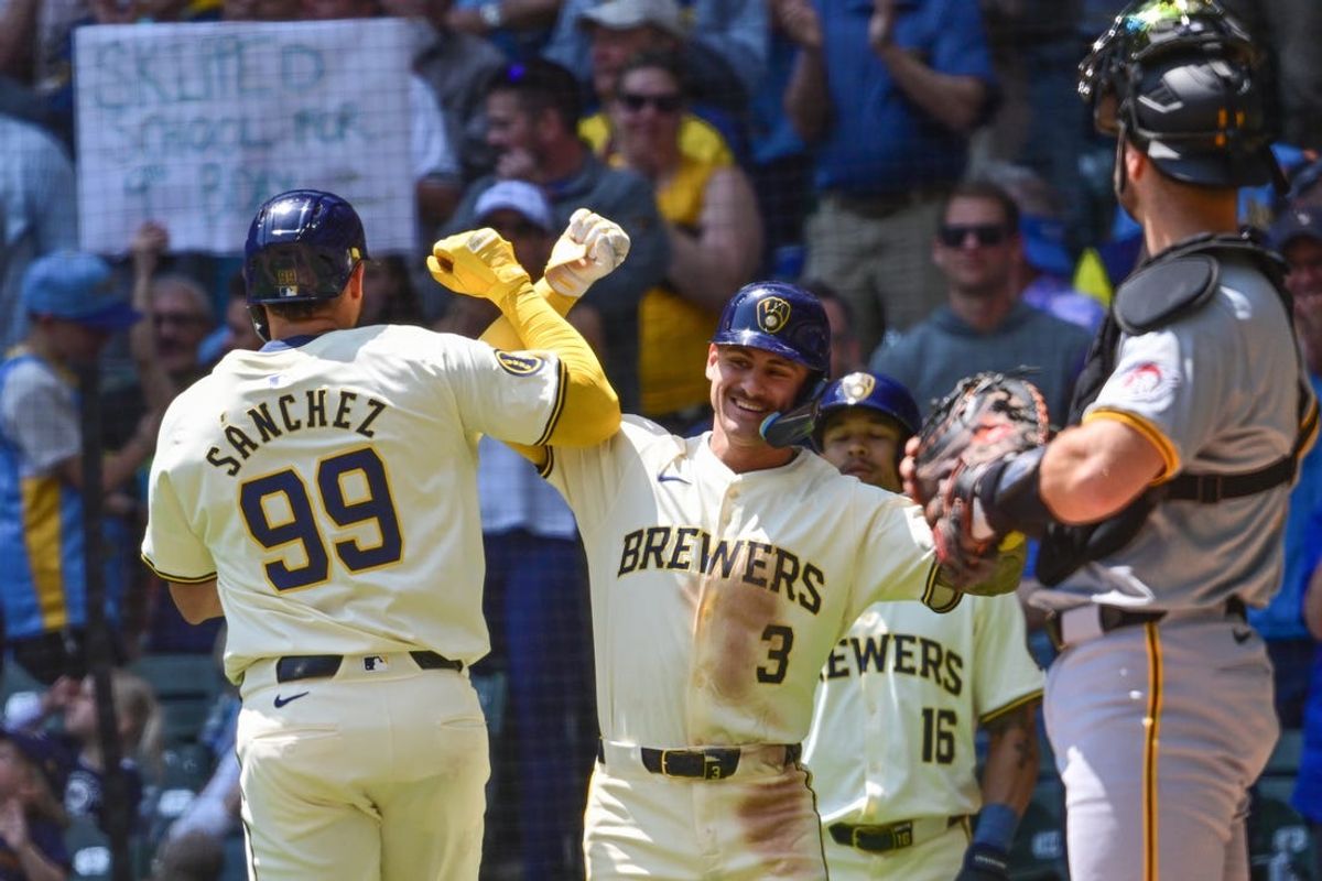 May 15, 2024; Milwaukee, Wisconsin, USA;  Milwaukee Brewers catcher Gary Sanchez (99) celebrates with second baseman Joey Ortiz (3) after hitting a 2-run home run in the third inning as Pittsburgh Pirates catcher Joey Bart (14) looks on at American Family Field. Mandatory Credit: Benny Sieu-USA TODAY Sports