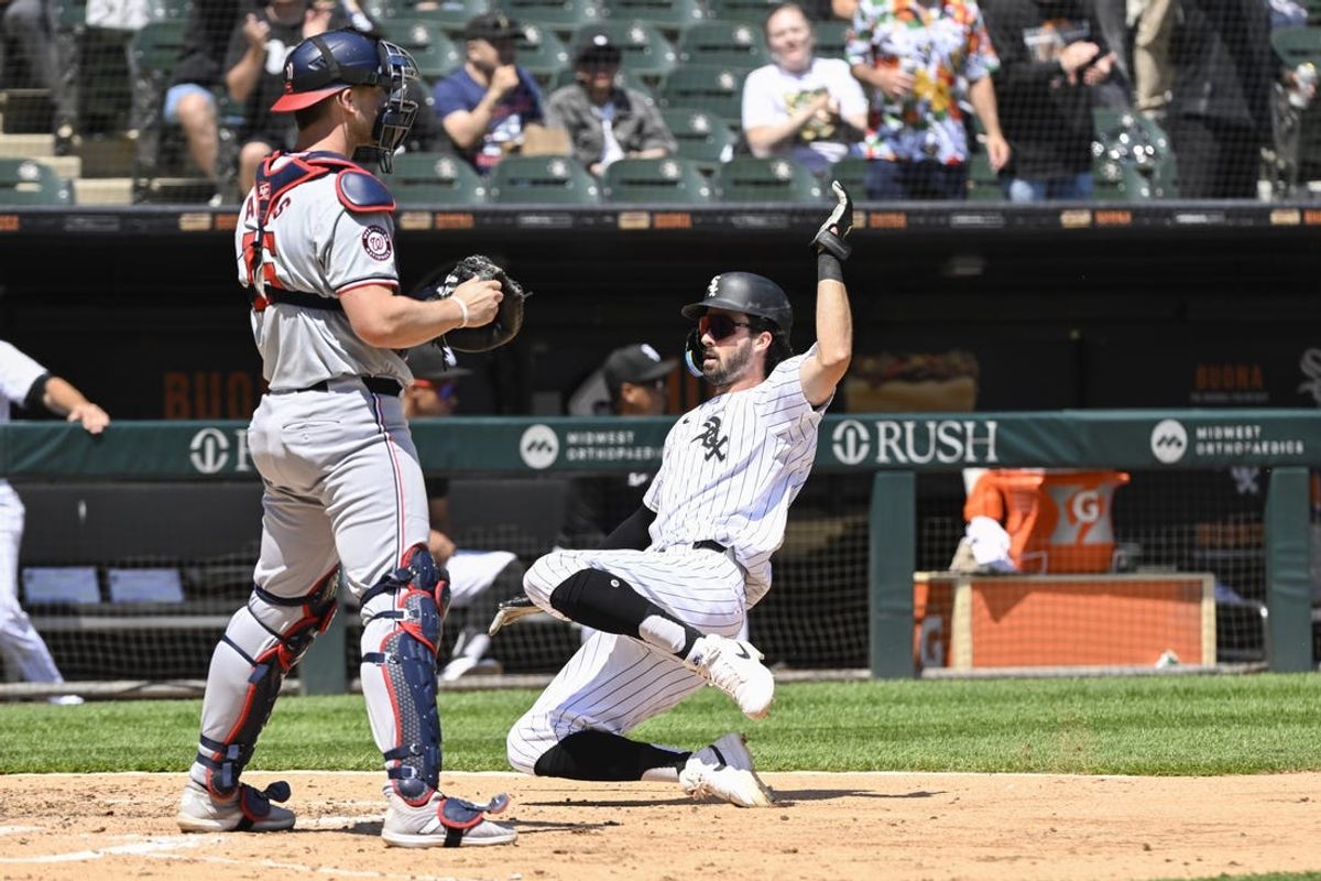 May 15, 2024; Chicago, Illinois, USA;  Chicago White Sox shortstop Braden Shewmake (17) scorers past Washington Nationals catcher Riley Adams (15) during the third inning  at Guaranteed Rate Field. Mandatory Credit: Matt Marton-USA TODAY Sports