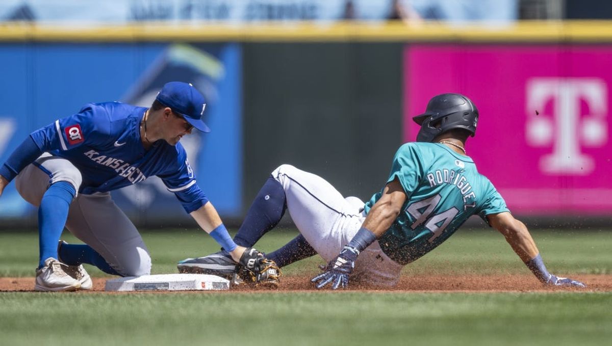 May 15, 2024; Seattle, Washington, USA; Kansas City Royals second baseman Michael Massey (19) tags out Seattle Mariners centerfielder Julio Rodriguez (44) attempting to steal second base during the first inning at T-Mobile Park. Mandatory Credit: Stephen Brashear-USA TODAY Sports