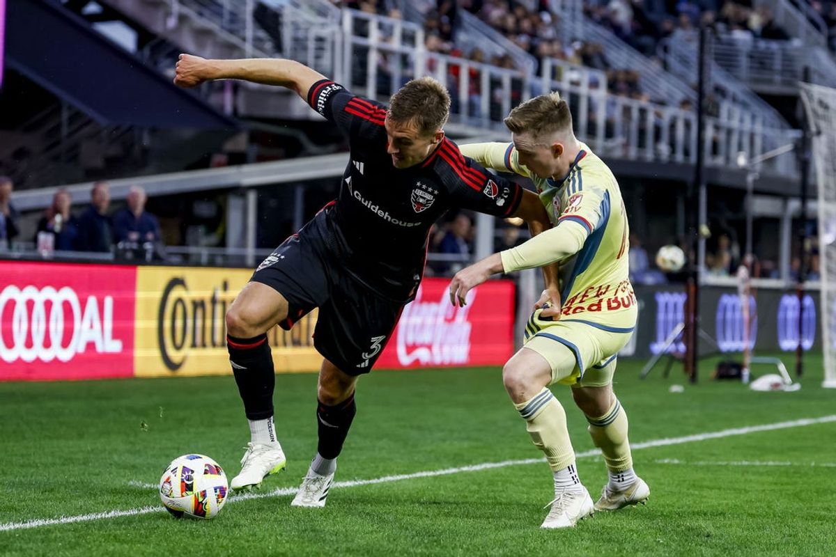 May 15, 2024; Washington, District of Columbia, USA; New York Red Bulls defender Cameron Harper (17) and D.C. United defender Lucas Bartlett (3) battle for the ball during the first half at Audi Field. Mandatory Credit: Geoff Burke-USA TODAY Sports