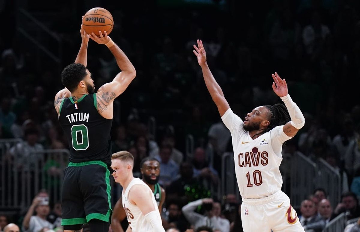 May 15, 2024; Boston, Massachusetts, USA; Boston Celtics forward Jayson Tatum (0) shoots for three points against Cleveland Cavaliers guard Darius Garland (10) in the second quarter during game five of the second round for the 2024 NBA playoffs at TD Garden. Mandatory Credit: David Butler II-USA TODAY Sports