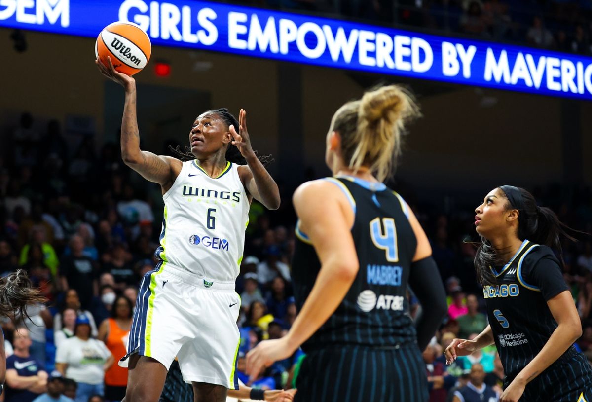 May 15, 2024; Arlington, Texas, USA;  Dallas Wings forward Natasha Howard (6) shoots past Chicago Sky guard Marina Mabrey (4) during the first quarter at College Park Center. Mandatory Credit: Kevin Jairaj-Imagn Images