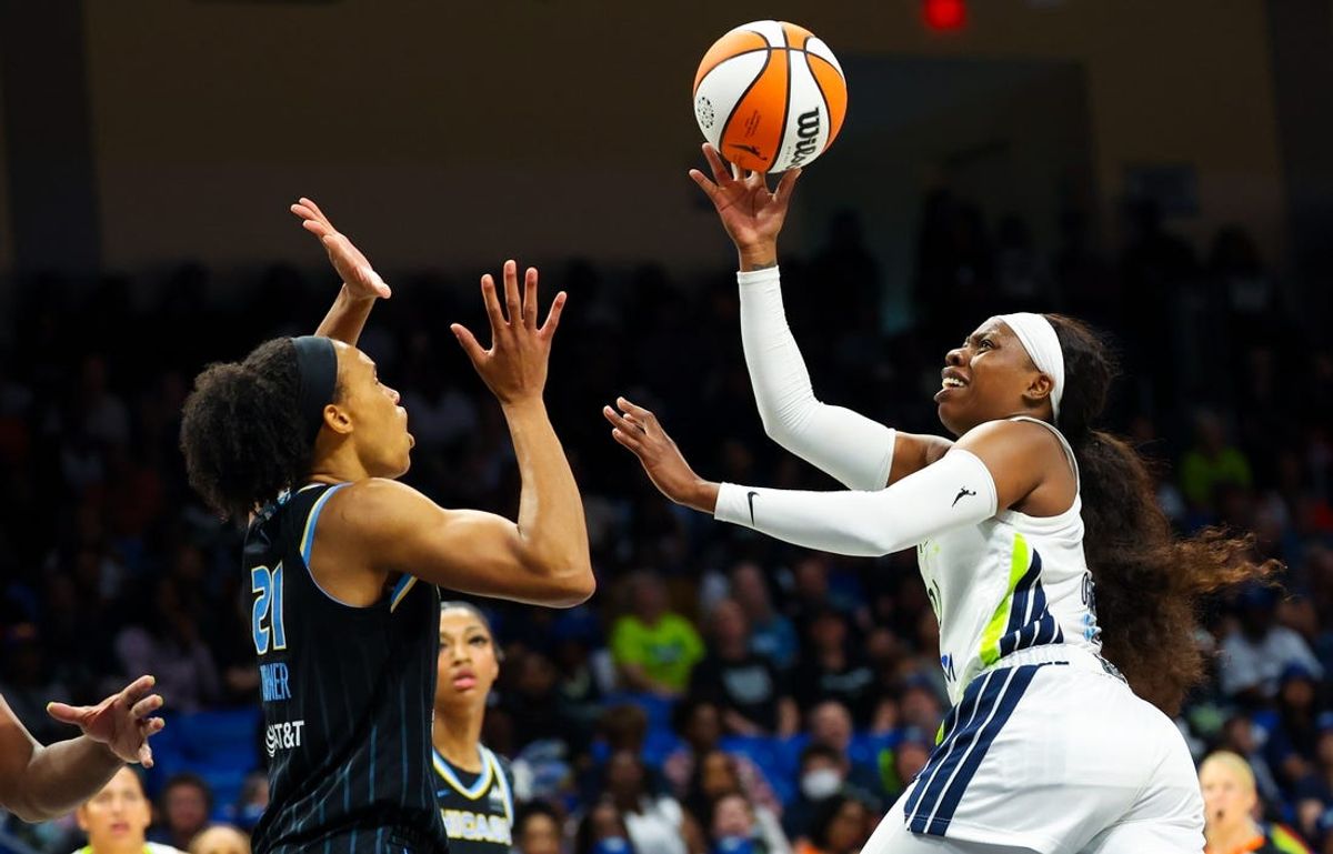 May 15, 2024; Arlington, Texas, USA;  Dallas Wings guard Arike Ogunbowale (24) shoots over Chicago Sky forward Brianna Turner (21) during the first half at College Park Center. Mandatory Credit: Kevin Jairaj-USA TODAY Sports