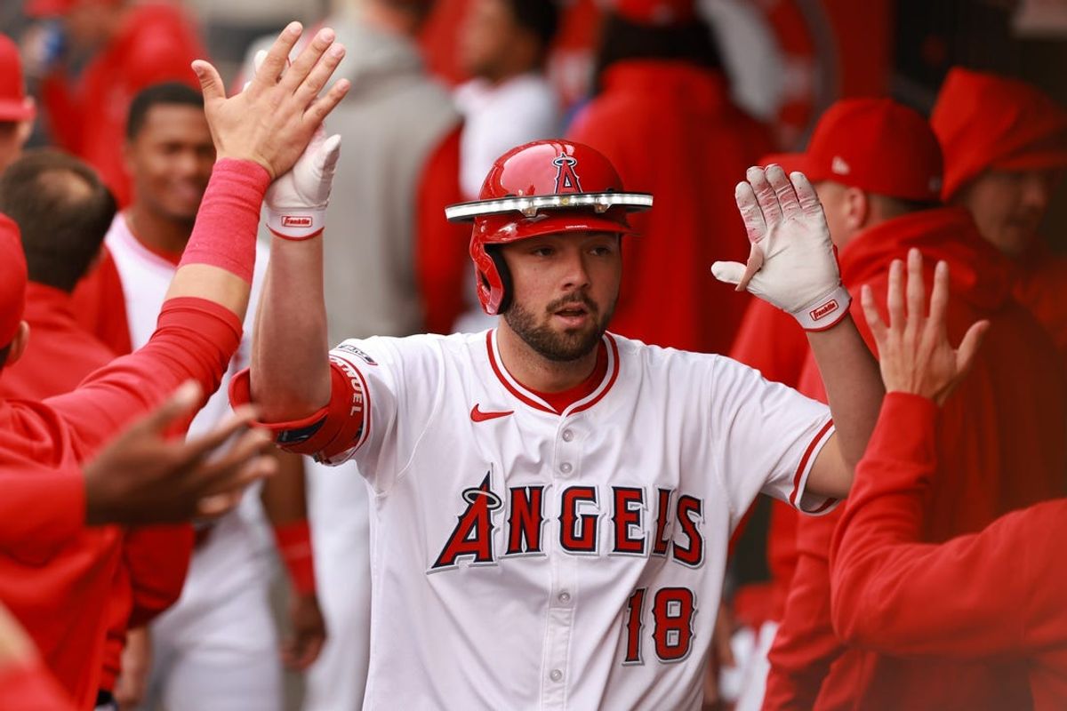 May 15, 2024; Anaheim, California, USA;  Los Angeles Angels first baseman Nolan Schanuel (18) is greeted by teammates in the dugout after hitting a home run during the first inning against the St. Louis Cardinals at Angel Stadium. Mandatory Credit: Kiyoshi Mio-USA TODAY Sports
