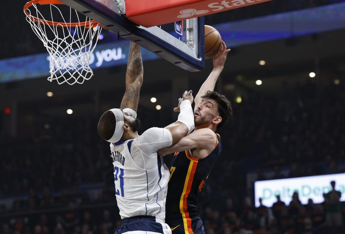 May 15, 2024; Oklahoma City, Oklahoma, USA; Dallas Mavericks center Daniel Gafford (21) defends a shot by Oklahoma City Thunder forward Chet Holmgren (7) during the first quarter of game five of the second round for the 2024 NBA playoffs at Paycom Center. Mandatory Credit: Alonzo Adams-USA TODAY Sports
