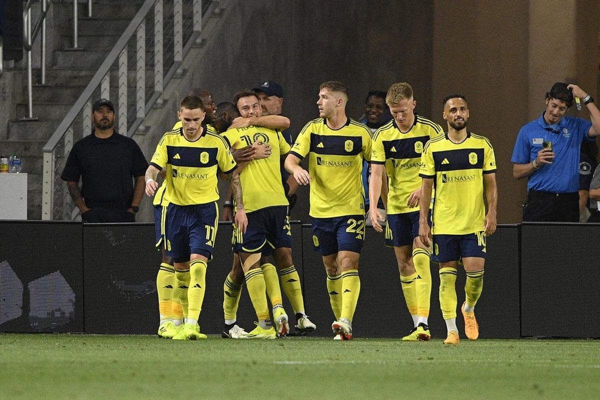 May 15, 2024; Nashville, Tennessee, USA; Nashville SC defender Shaq Moore (18) reacts with teammates after scoring a goal against Toronto FC during the second half at Geodis Park. Mandatory Credit: Steve Roberts-USA TODAY Sports