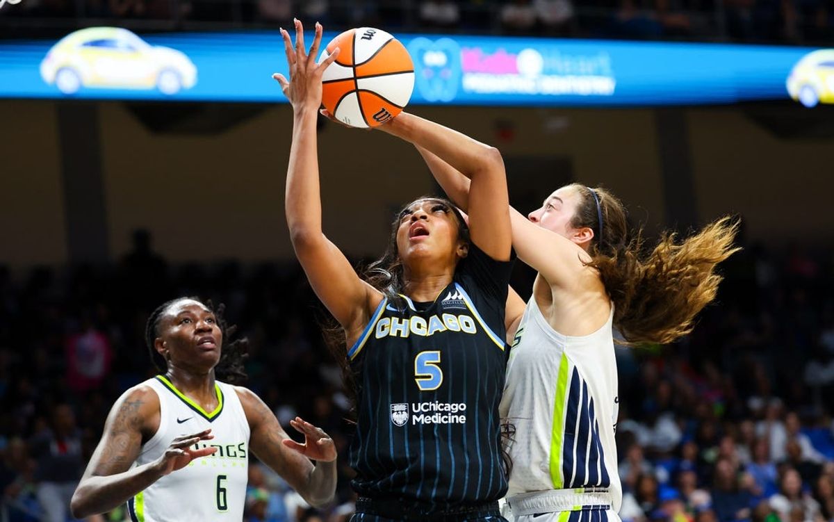 May 15, 2024; Arlington, Texas, USA;  Chicago Sky forward Angel Reese (5) and Dallas Wings forward Maddy Siegrist (20) go for the ball during the second half at College Park Center. Mandatory Credit: Kevin Jairaj-USA TODAY Sports