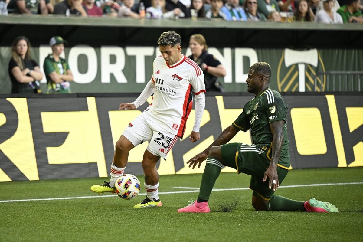 May 15, 2024; Portland, Oregon, USA; San Jose Earthquakes midfielder Hernan Lopez (23) plays the defend by Portland Timbers forward Dairon Asprilla (27) in the first half at Providence Park. Mandatory Credit: Troy Wayrynen-USA TODAY Sports