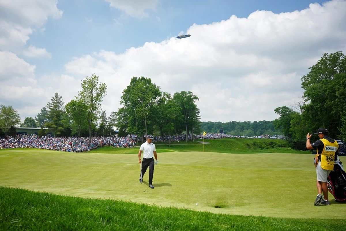 May 16, 2024; Louisville, Kentucky, USA; Xander Schauffele lines up a shot on the eighth hole after his ball landed on a drain cover during the first round of the PGA Championship golf tournament at Valhalla Golf Club. Mandatory Credit: Aaron Doster-USA TODAY Sports