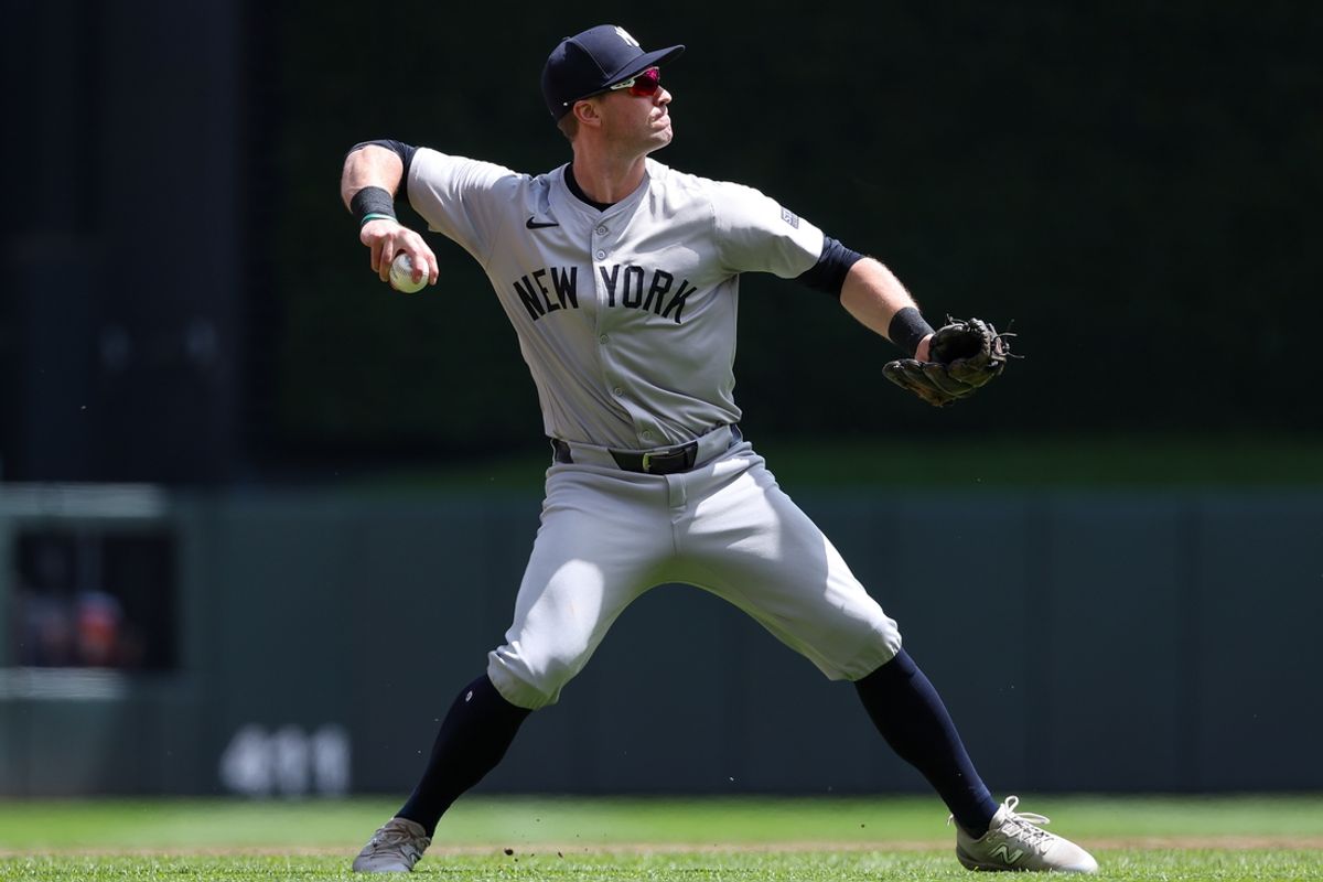 May 16, 2024; Minneapolis, Minnesota, USA; New York Yankees third baseman Jon Berti (19) throws the ball to first base to get out Minnesota Twins Willi Castro (50) during the second inning at Target Field. Mandatory Credit: Matt Krohn-Imagn Images