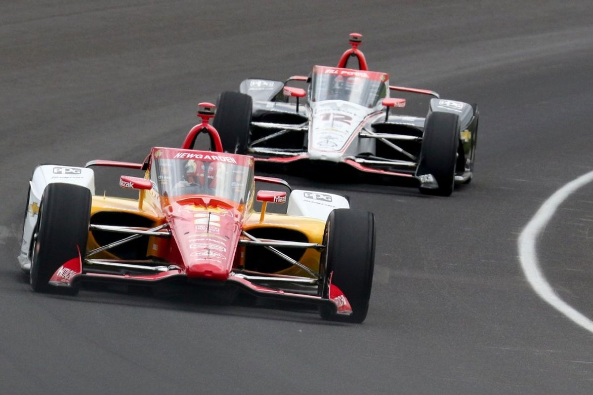 Team Penske driver Josef Newgarden (2) leads Team Penske driver Will Power (12) through the first turn Thursday, May 16, 2024, during the third day of practice ahead of the 108th running of the Indianapolis 500 at Indianapolis Motor Speedway.