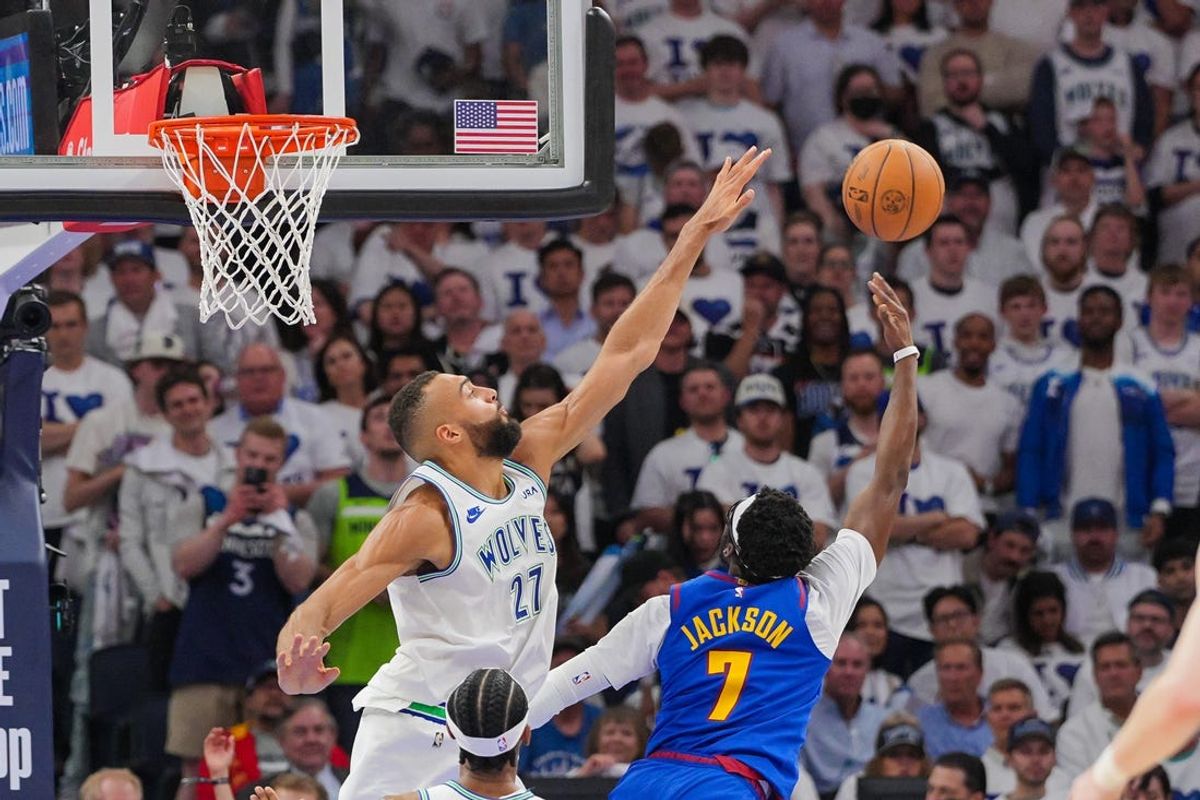 May 16, 2024; Minneapolis, Minnesota, USA; Denver Nuggets guard Reggie Jackson (7) shoots against the Minnesota Timberwolves center Rudy Gobert (27) in the fourth quarter during game six of the second round for the 2024 NBA playoffs at Target Center. Mandatory Credit: Brad Rempel-USA TODAY Sports