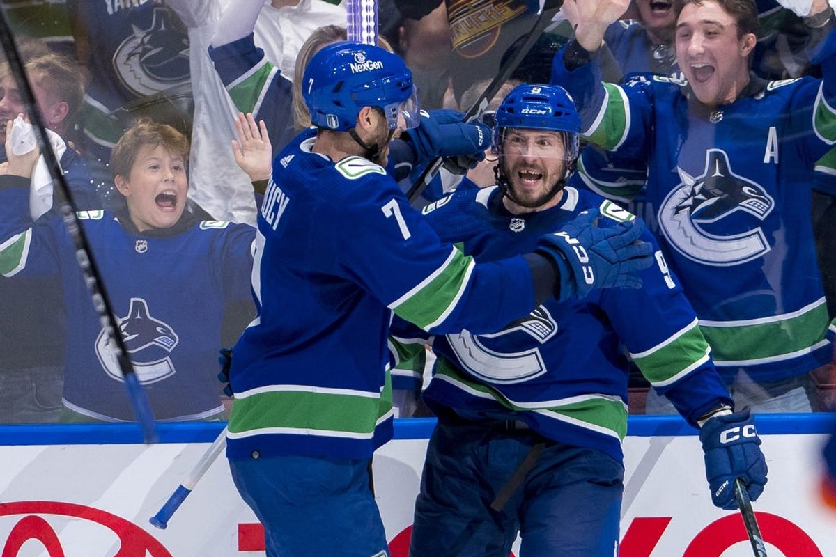 May 16, 2024; Vancouver, British Columbia, CAN; Vancouver Canucks defenseman Carson Soucy (7) and forward J.T. Miller (9) celebrate Miller’s game winning goal against the Edmonton Oilers during the third period in game five of the second round of the 2024 Stanley Cup Playoffs at Rogers Arena. Mandatory Credit: Bob Frid-USA TODAY Sports