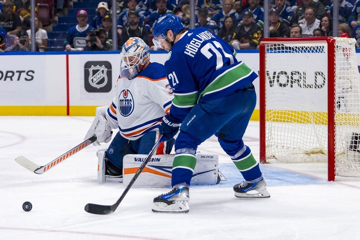 May 16, 2024; Vancouver, British Columbia, CAN; Edmonton Oilers goalie Calvin Pickard (30) watches Vancouver Canucks forward Nils Hoglander (21) handle the puck during the third period in game five of the second round of the 2024 Stanley Cup Playoffs at Rogers Arena. Mandatory Credit: Bob Frid-USA TODAY Sports