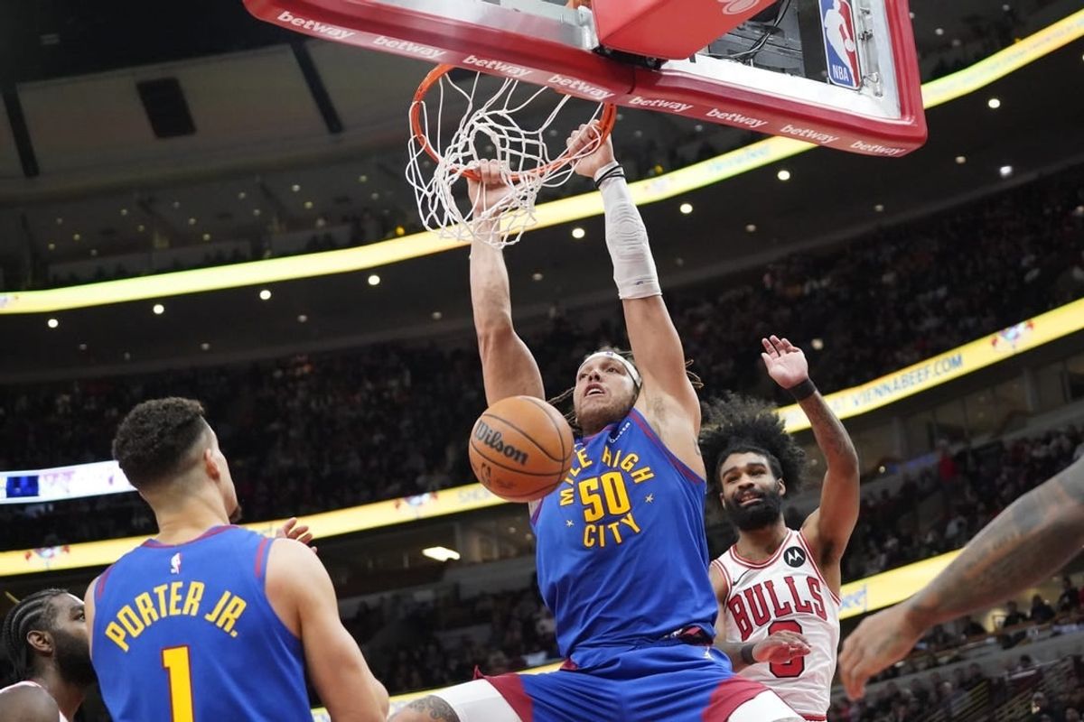 Dec 12, 2023; Chicago, Illinois, USA; Denver Nuggets forward Aaron Gordon (50) dunks the ball against the Chicago Bulls during the second half at United Center.