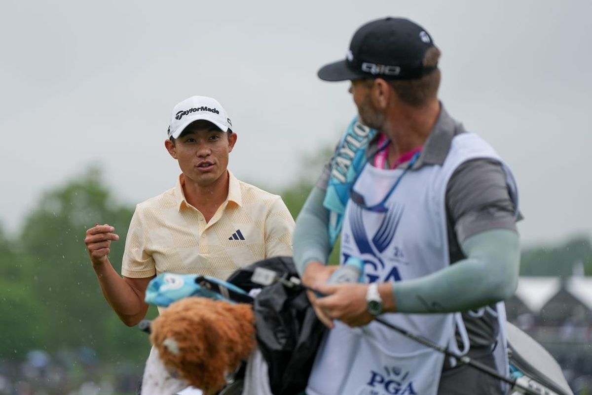 May 17, 2024; Louisville, Kentucky, USA; Collin Morikawa talks to his caddie after finishing the 18th hole during the second round of the PGA Championship golf tournament at Valhalla Golf Club. Mandatory Credit: Clare Grant-USA TODAY Sports