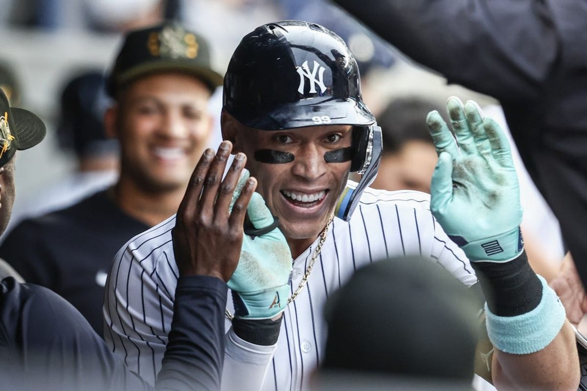 May 17, 2024; Bronx, New York, USA;  New York Yankees center fielder Aaron Judge (99) is greeted in the dugout after hitting a solo home run in the first inning against the Chicago White Sox at Yankee Stadium. Mandatory Credit: Wendell Cruz-USA TODAY Sports