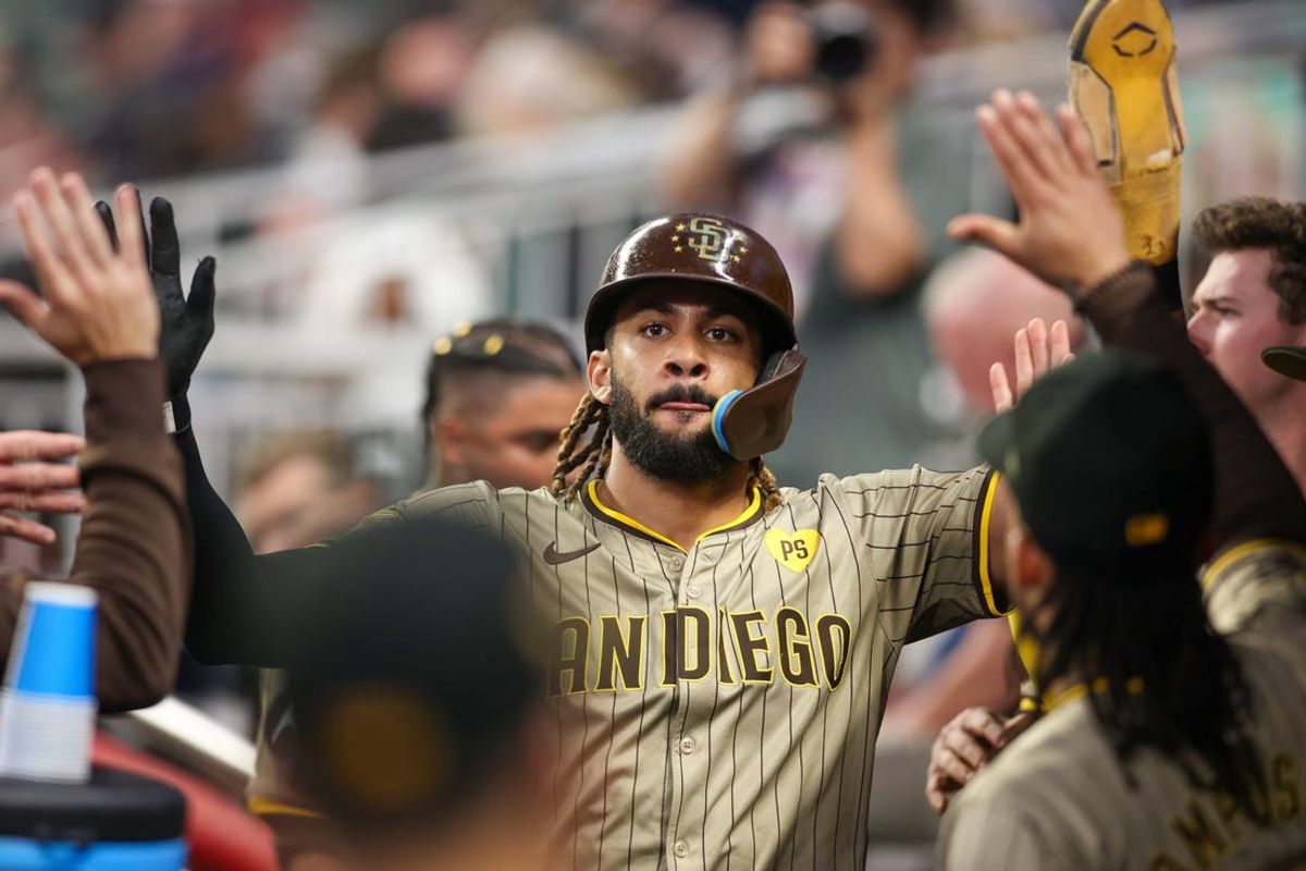 May 17, 2024; Atlanta, Georgia, USA; San Diego Padres right fielder Fernando Tatis Jr. (23) celebrates with teammates after scoring a run against the Atlanta Braves in the fifth inning at Truist Park. Mandatory Credit: Brett Davis-USA TODAY Sports