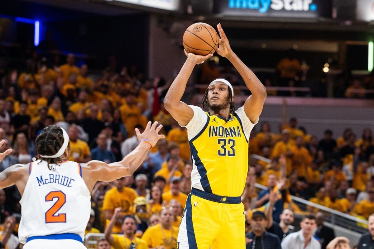 May 17, 2024; Indianapolis, Indiana, USA; Indiana Pacers center Myles Turner (33) shoots the ball while New York Knicks guard Miles McBride (2) defends during game six of the second round for the 2024 NBA playoffs at Gainbridge Fieldhouse. Mandatory Credit: Trevor Ruszkowski-USA TODAY Sports