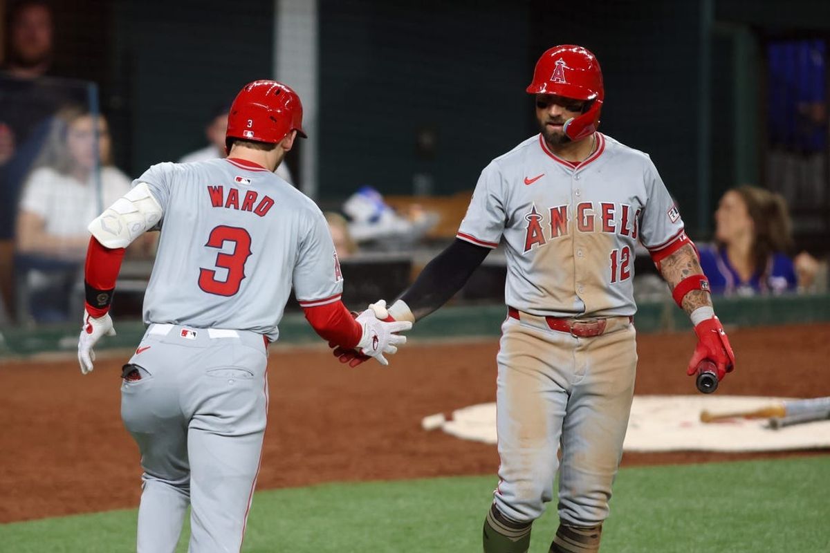 May 17, 2024; Arlington, Texas, USA;  Los Angeles Angels left fielder Taylor Ward (3) is congratulated by center fielder Kevin Pillar (12) after hitting a home run in the sixth inning against the Texas Rangers at Globe Life Field. Mandatory Credit: Tim Heitman-USA TODAY Sports