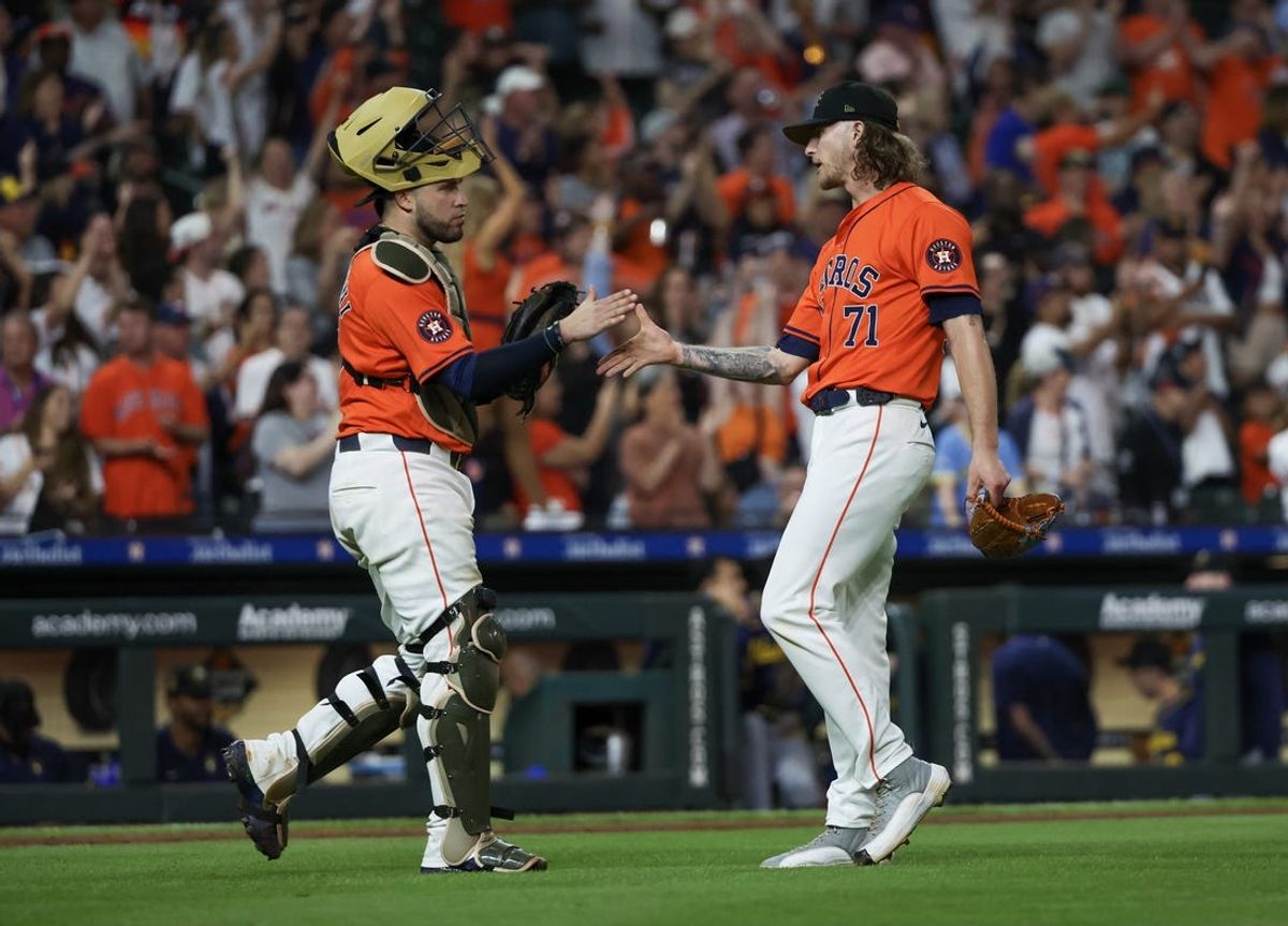May 17, 2024; Houston, Texas, USA; Houston Astros catcher Victor Caratini (17) relief pitcher Josh Hader (71) celebrates the win against the Milwaukee Brewers at Minute Maid Park. Mandatory Credit: Thomas Shea-USA TODAY Sports