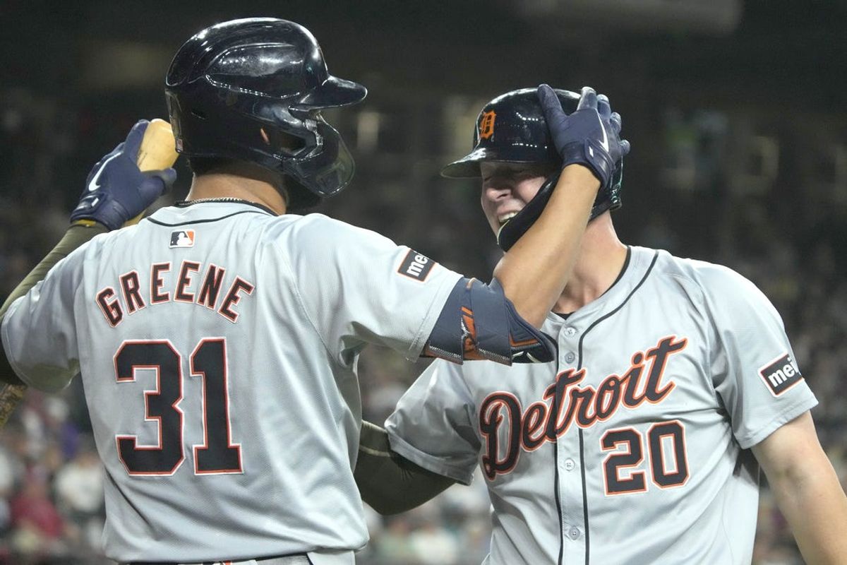 May 17, 2024; Phoenix, Arizona, USA; Detroit Tigers first base Spencer Torkelson (20) celebrates with outfielder Riley Greene (31) after scoring against the Arizona Diamondbacks in the second inning at Chase Field. Mandatory Credit: Rick Scuteri-USA TODAY Sports