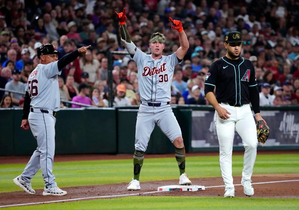 Tigers Kerry Carpenter (30) celebrates a 2-RBI triple against the Diamondbacks during a game at Chase Field on Friday, May 17, 2024.