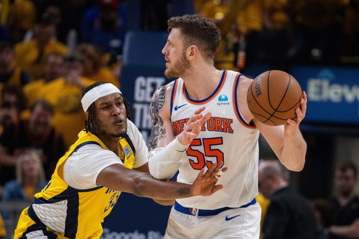 May 17, 2024; Indianapolis, Indiana, USA; New York Knicks center Isaiah Hartenstein (55) holds the ball while Indiana Pacers center Myles Turner (33) defends during game six of the second round for the 2024 NBA playoffs at Gainbridge Fieldhouse. Mandatory Credit: Trevor Ruszkowski-USA TODAY Sports