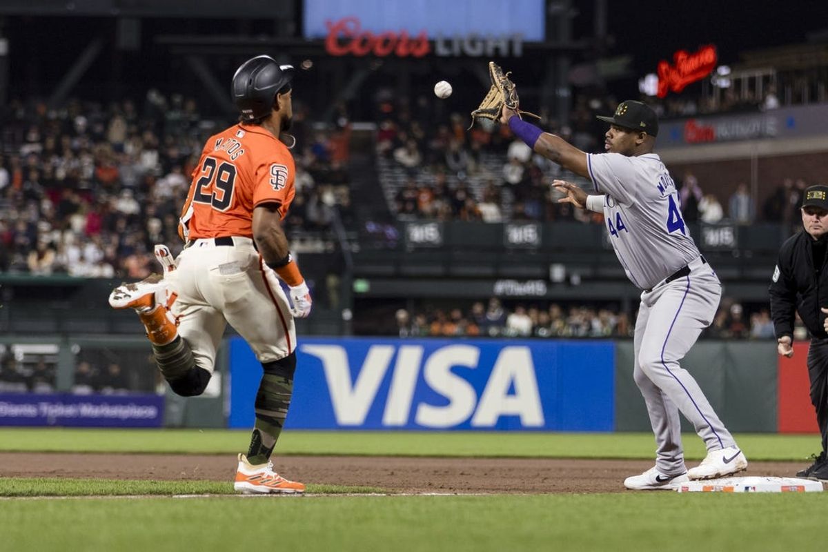 May 17, 2024; San Francisco, California, USA; Colorado Rockies first baseman Elehuris Montero (44) tags San Francisco Giants center fielder Luis Matos (29) during the seventh inning at Oracle Park. Mandatory Credit: John Hefti-USA TODAY Sports