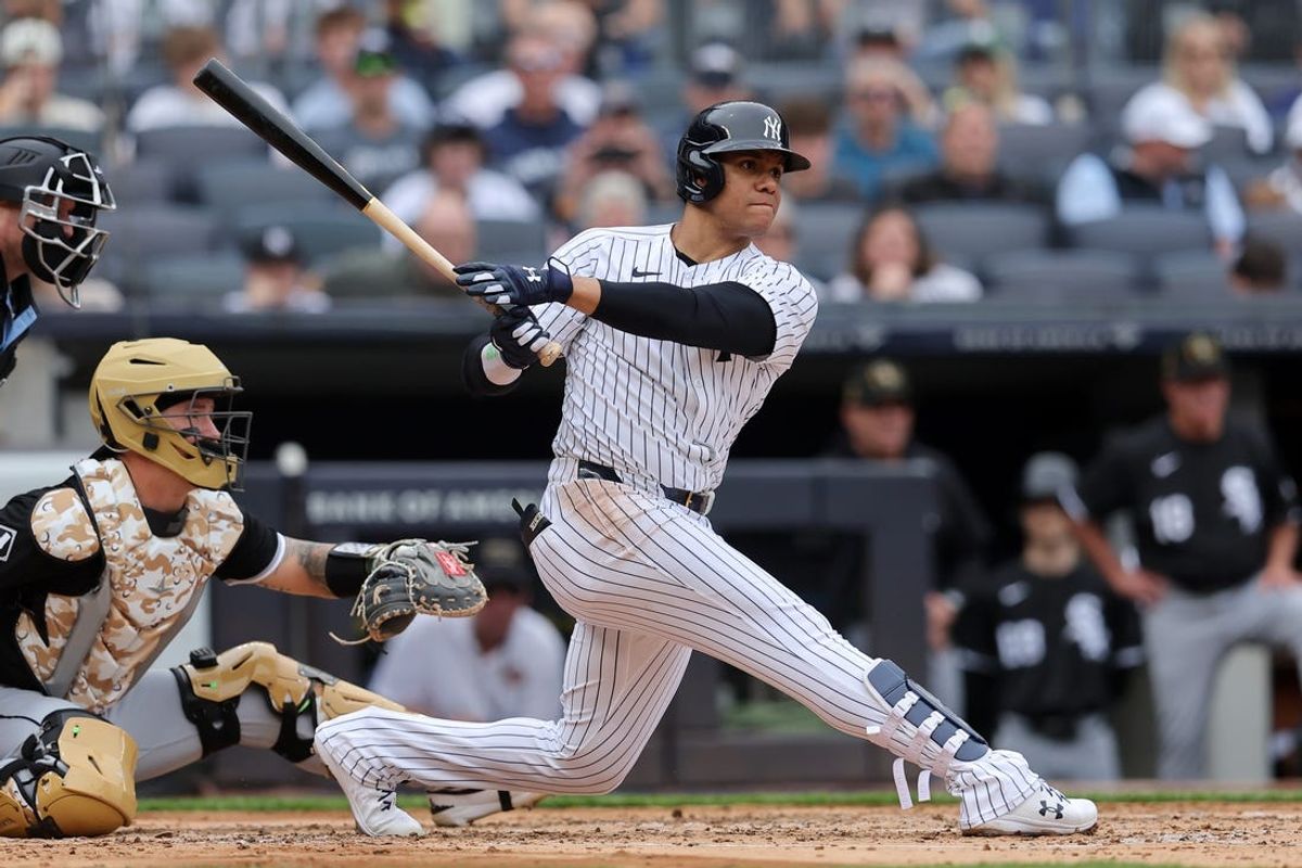 May 18, 2024; Bronx, New York, USA; New York Yankees right fielder Juan Soto (22) follows through on an RBI single during the second inning against the Chicago White Sox at Yankee Stadium. Mandatory Credit: Brad Penner-USA TODAY Sports