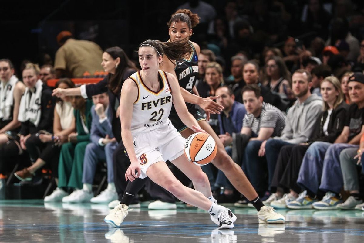 May 18, 2024; Brooklyn, New York, USA;  Indiana Fever guard Caitlin Clark (22) spins away from New York Liberty forward Nyara Sabally (8) in the fourth quarter at Barclays Center. Mandatory Credit: Wendell Cruz-USA TODAY Sports