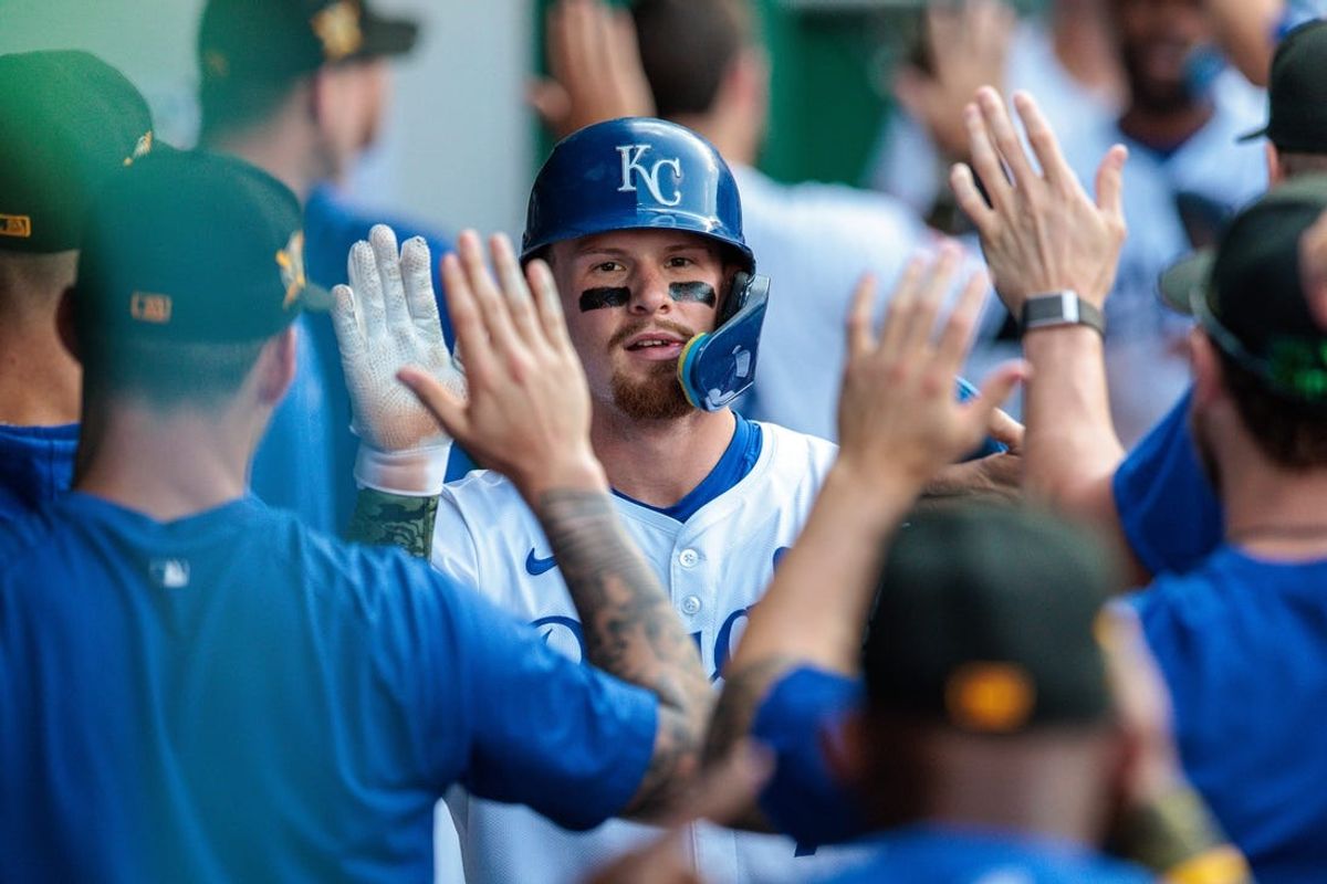 May 18, 2024; Kansas City, Missouri, USA; Kansas City Royals shortstop Bobby Witt Jr. (7) celebrates in the dugout after scoring during the first inning against the Oakland Athletics at Kauffman Stadium. Mandatory Credit: William Purnell-USA TODAY Sports