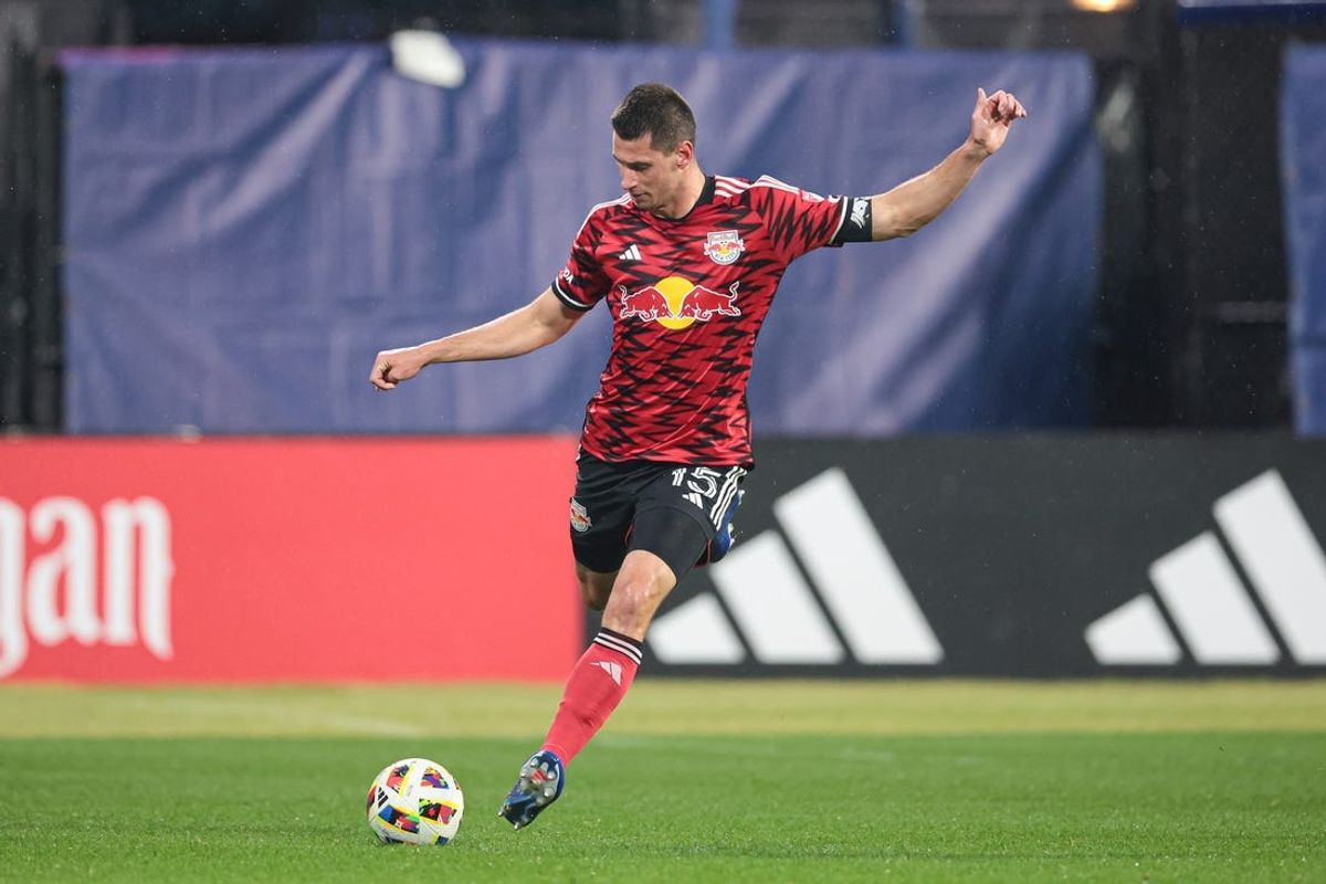 May 18, 2024; Queens, New York, USA; New York Red Bulls defender Sean Nealis (15) kicks the ball against New York City FC during the first half at Citi Field. Mandatory Credit: Vincent Carchietta-USA TODAY Sports