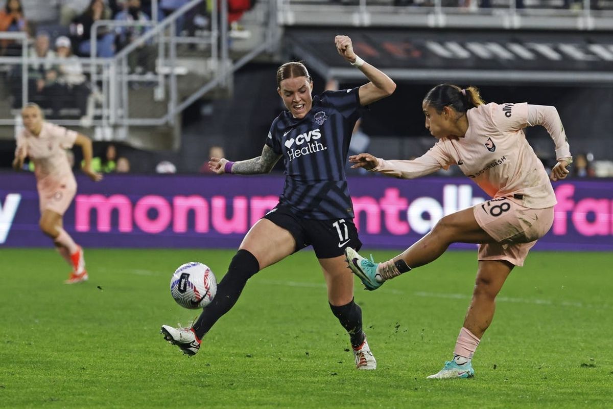 May 18, 2024; Washington, District of Columbia, USA; Angel City FC midfielder Lily Nabet (28) takes a shot on goal as Washington Spirit midfielder Hal Hershfelt (17) defends during the first half at Audi Field. Mandatory Credit: Geoff Burke-USA TODAY Sports