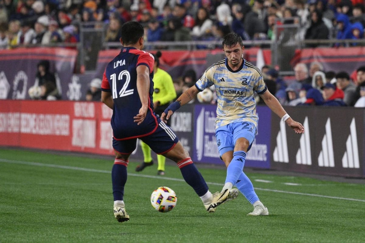 May 18, 2024; Foxborough, Massachusetts, USA; Philadelphia Union defender Kai Wagner (27) passes the ball against New England Revolution defender Nick Lima (12) during the first half at Gillette Stadium. Mandatory Credit: Eric Canha-USA TODAY Sports