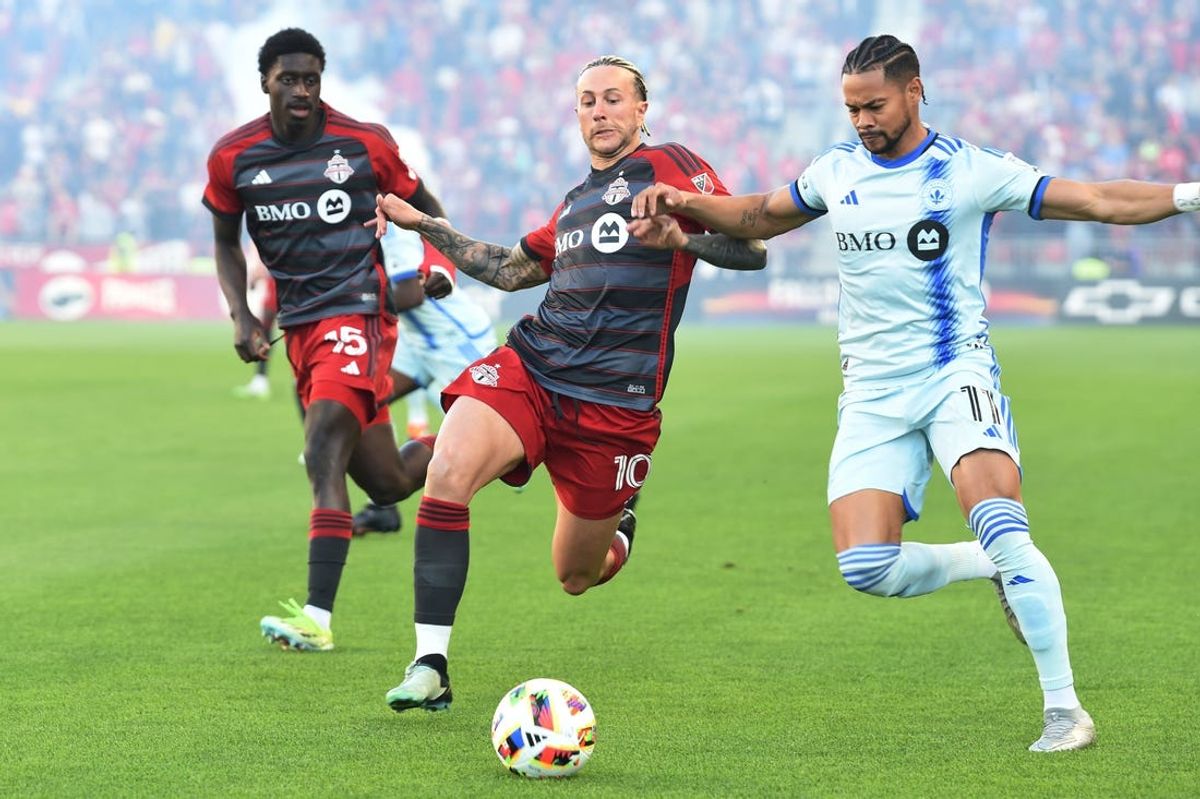 May 18, 2024; Toronto, Ontario, CAN; Toronto FC forward Federico Bernardeschi (10) battles CF Montreal forward Ariel Lassiter (11 for the ball in the first half  at BMO Field. Mandatory Credit: Dan Hamilton-USA TODAY Sports