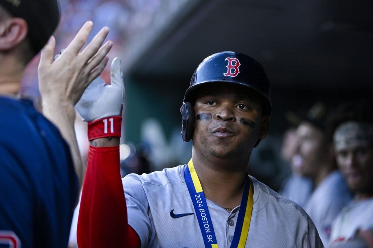 May 18, 2024; St. Louis, Missouri, USA;  Boston Red Sox third baseman Rafael Devers (11) is congratulated by teammates after hitting a solo home run against the St. Louis Cardinals during the fourth inning at Busch Stadium. Mandatory Credit: Jeff Curry-USA TODAY Sports
