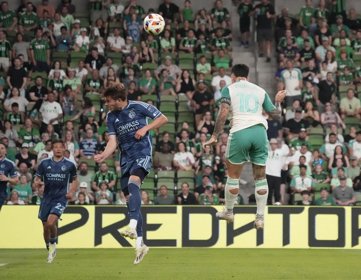 May 18, 2024; Austin, Texas, USA; Austin FC midfielder Sebastian Driussi (10) heads the ball past Sporting Kansas City midfielder Jake Davis (17) for a goal during the second half at Q2 Stadium. Mandatory Credit: Scott Wachter-USA TODAY Sports