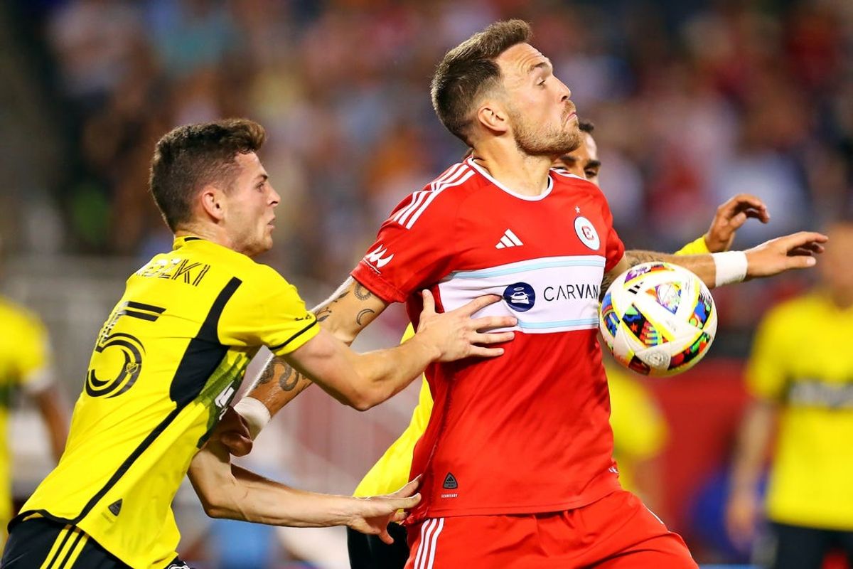 May 18, 2024; Chicago, Illinois, USA; Chicago Fire FC defender Rafael Czichos (5) and Columbus Crew midfielder Sean Zawadzki (25) go for the ball during the second half at Soldier Field. Mandatory Credit: Melissa Tamez-USA TODAY Sports