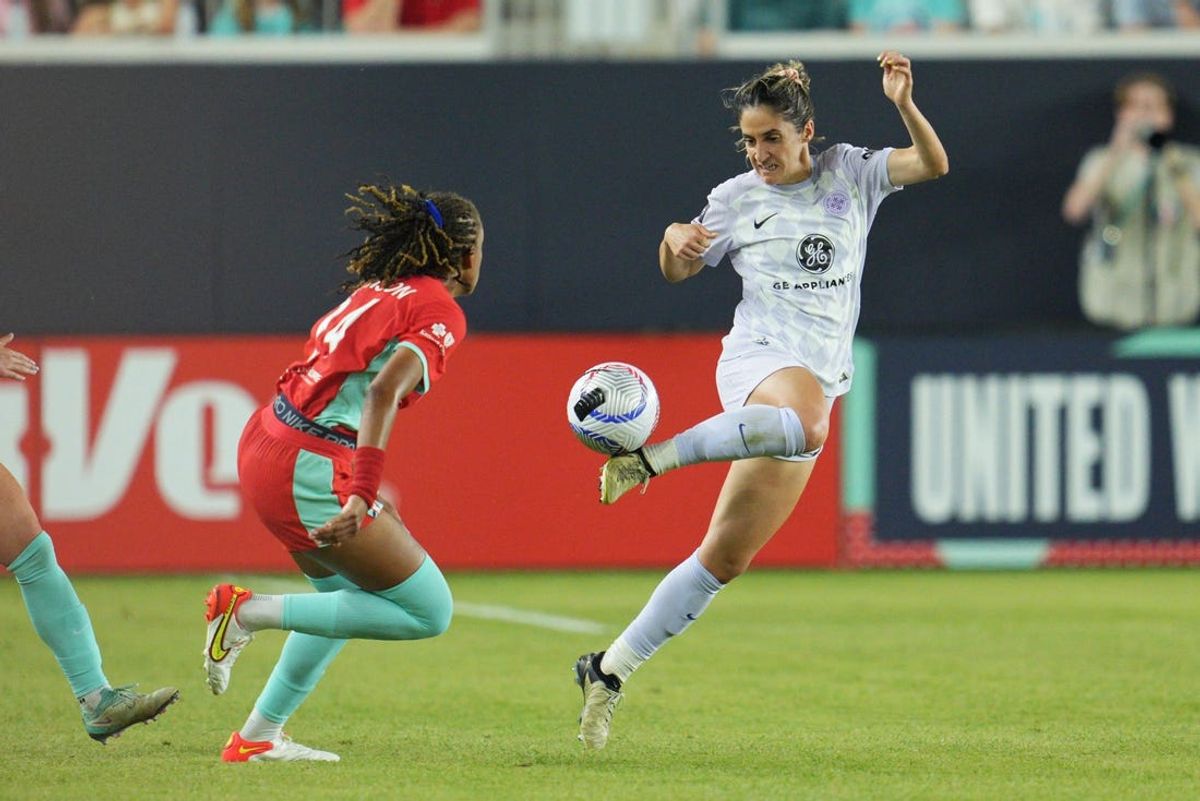 May 18, 2024; Kansas City, Missouri, USA; Racing Louisville FC midfielder Savannah DeMelo (7) controls the ball against Kansas City Current defender Gabrielle Robinson (24) during the first half at CPKC Stadium. Mandatory Credit: Jay Biggerstaff-USA TODAY Sports