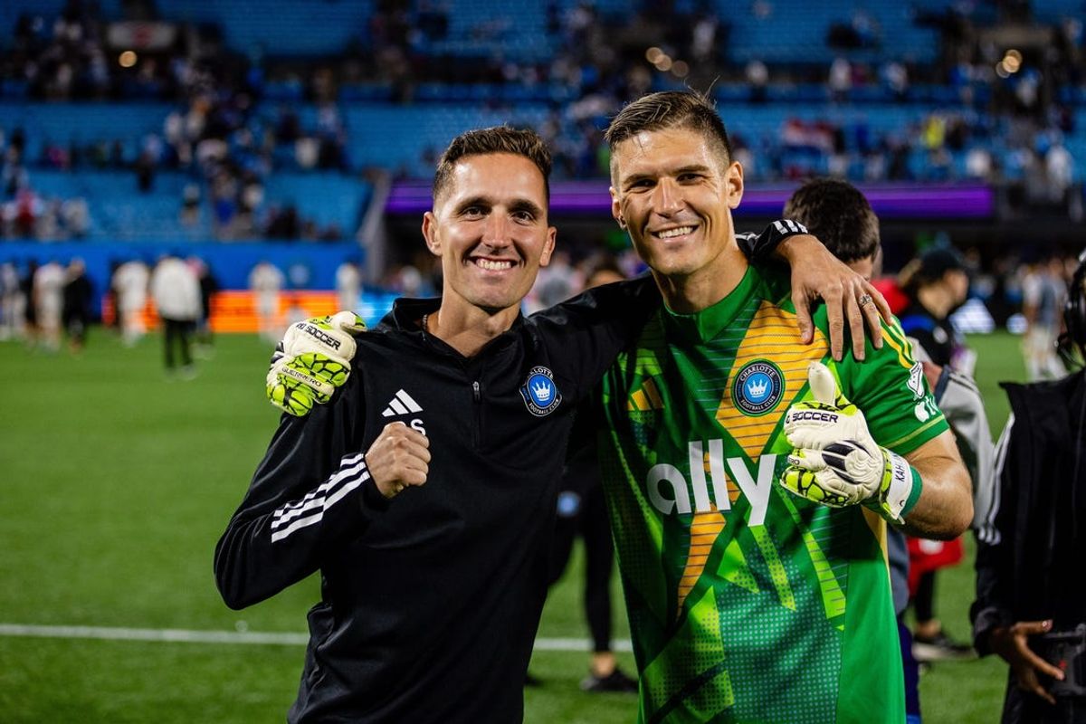 May 18, 2024; Charlotte, North Carolina, USA; Robert Stout poses with Charlotte FC goalkeeper Kristijan Kahlina (1) after the match against the Los Angeles Galaxy at Bank of America Stadium. Mandatory Credit: Scott Kinser-USA TODAY Sports