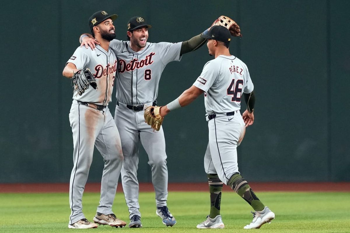May 18, 2024; Phoenix, Arizona, USA; Detroit Tigers outfielder Riley Greene (31) and Detroit Tigers third base Matt Vierling (8) and Detroit Tigers outfielder Wenceel Pérez (46) celebrate after defeating the Arizona Diamondbacks at Chase Field. Mandatory Credit: Joe Camporeale-USA TODAY Sports