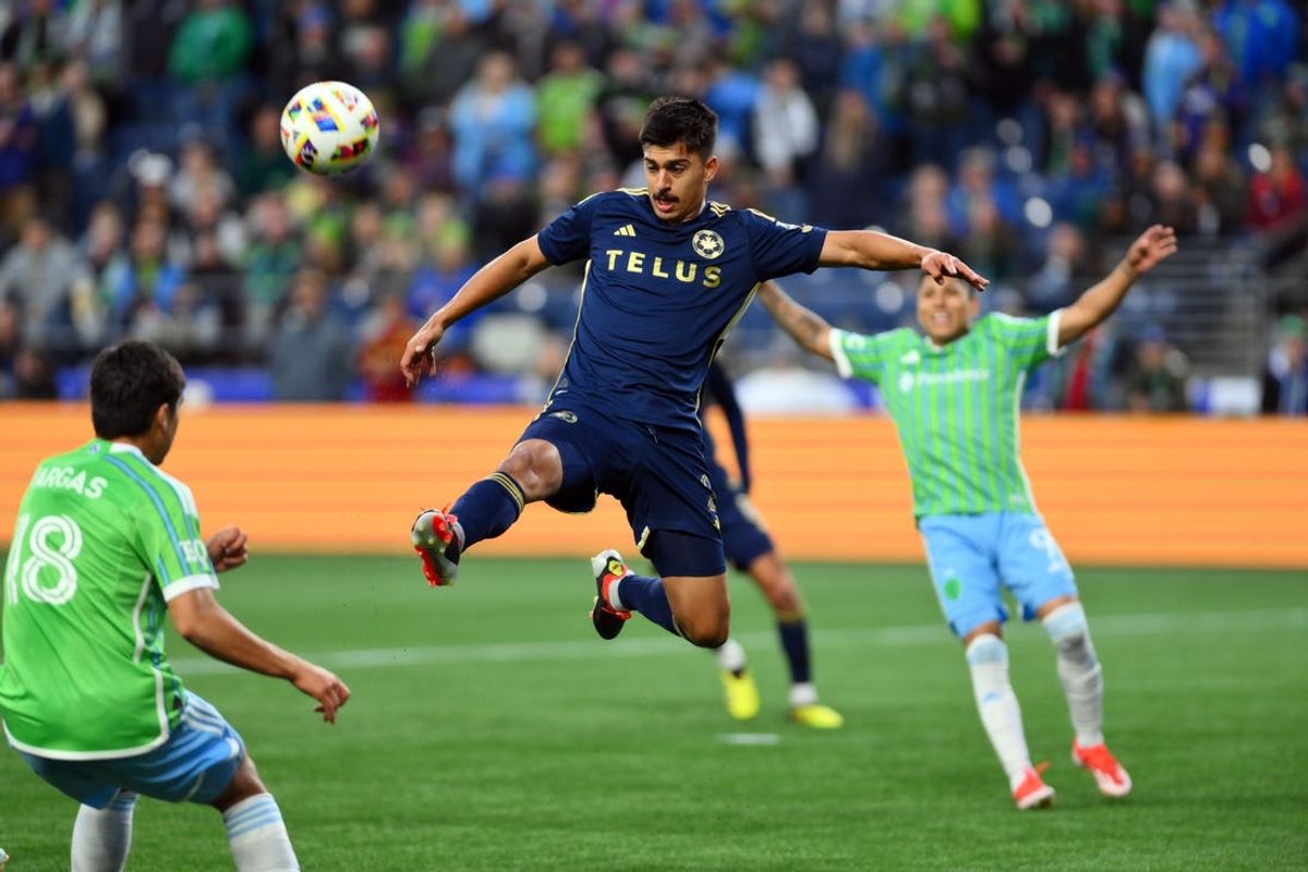 May 18, 2024; Seattle, Washington, USA; Vancouver Whitecaps FC defender Mathias Laborda (2) controls the ball against Seattle Sounders FC midfielder Obed Vargas (18) in the first half at Lumen Field. Mandatory Credit: Steven Bisig-USA TODAY Sports
