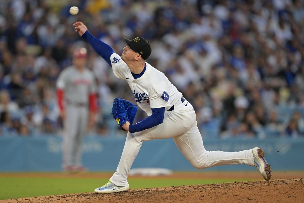 May 18, 2024; Los Angeles, California, USA;  Los Angeles Dodgers starting pitcher Walker Buehler (21) delivers to the plate in the sixth inning against the Cincinnati Reds at Dodger Stadium. Mandatory Credit: Jayne Kamin-Oncea-USA TODAY Sports