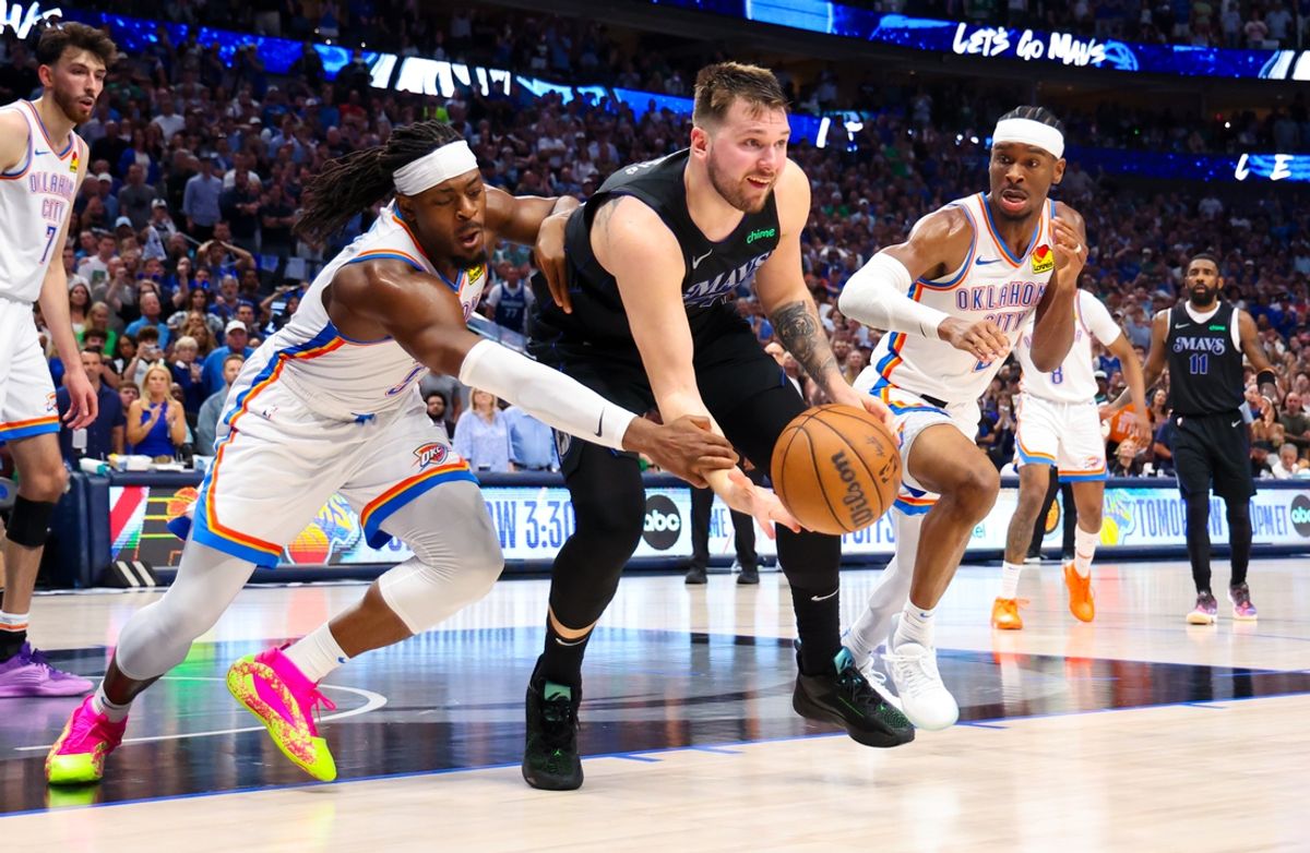 May 18, 2024; Dallas, Texas, USA;  Dallas Mavericks guard Luka Doncic (77) passes the ball as Oklahoma City Thunder guard Luguentz Dort (5) and Oklahoma City Thunder guard Shai Gilgeous-Alexander (2) during the second half in game six of the second round of the 2024 NBA playoffs at American Airlines Center. Mandatory Credit: Kevin Jairaj-Imagn Images