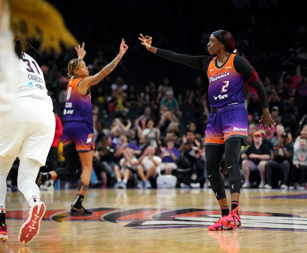 Mercury guard Kahleah Copper (2) and Natasha Cloud (0) celebrate a three pointer during the home opener against the Dream at the Footprint Center on Saturday, May 18, 2024.